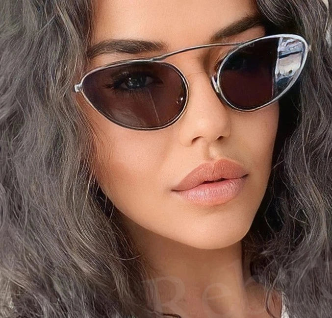 Unique oval cat eye sunglasses, fashionable triangular metal frame. 